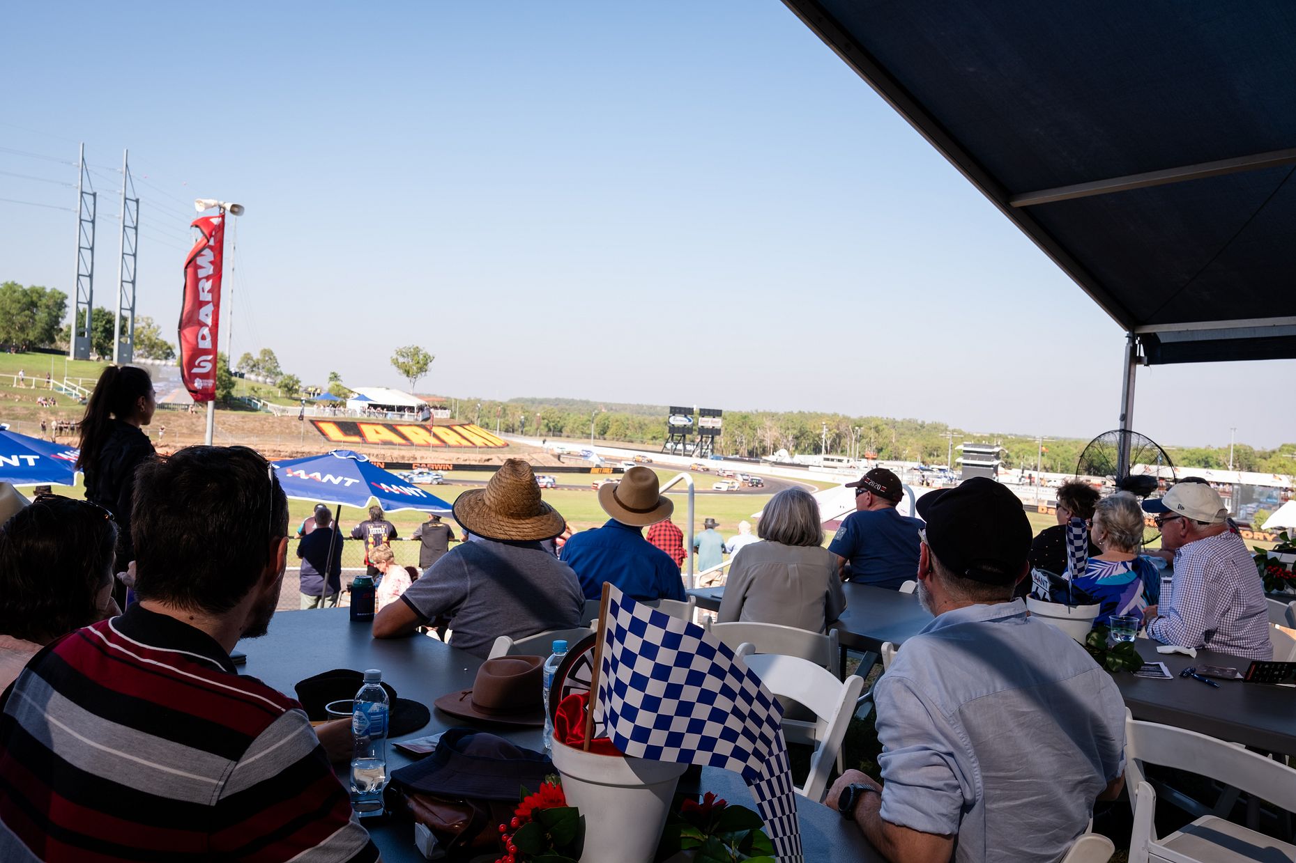 Group of spectators watching the race from elevated Terraces viewing space