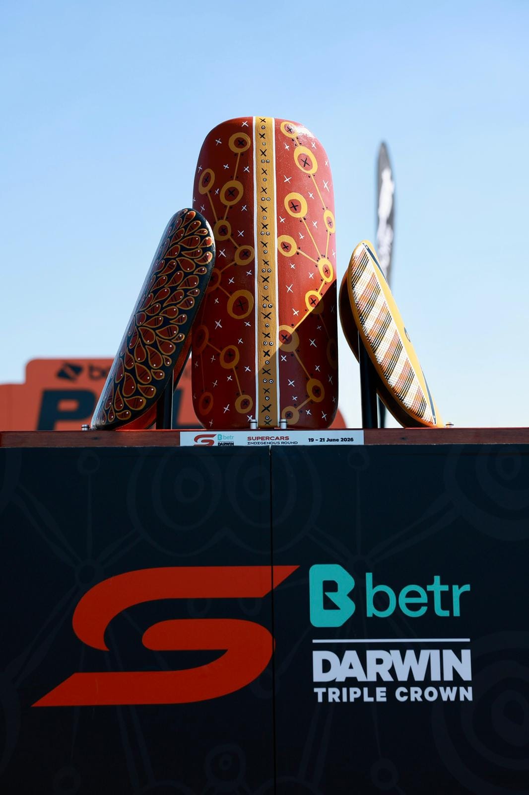 The Darwin Triple Crown Indigenous Round trophy sits on display with event branding at Hidden Valley Raceway.