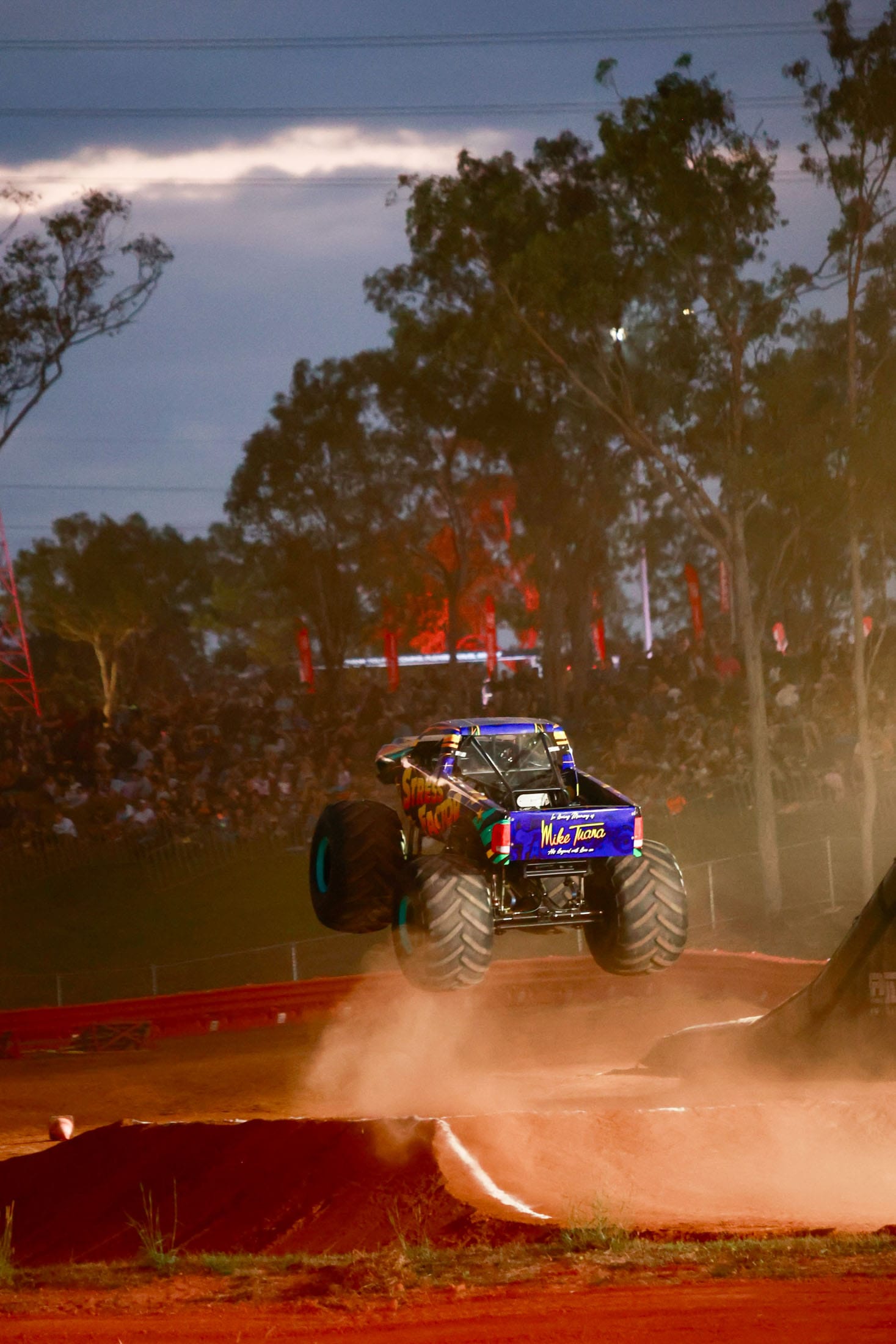 Monster truck jumping through dust during a demonstration at Hidden Valley Raceway.