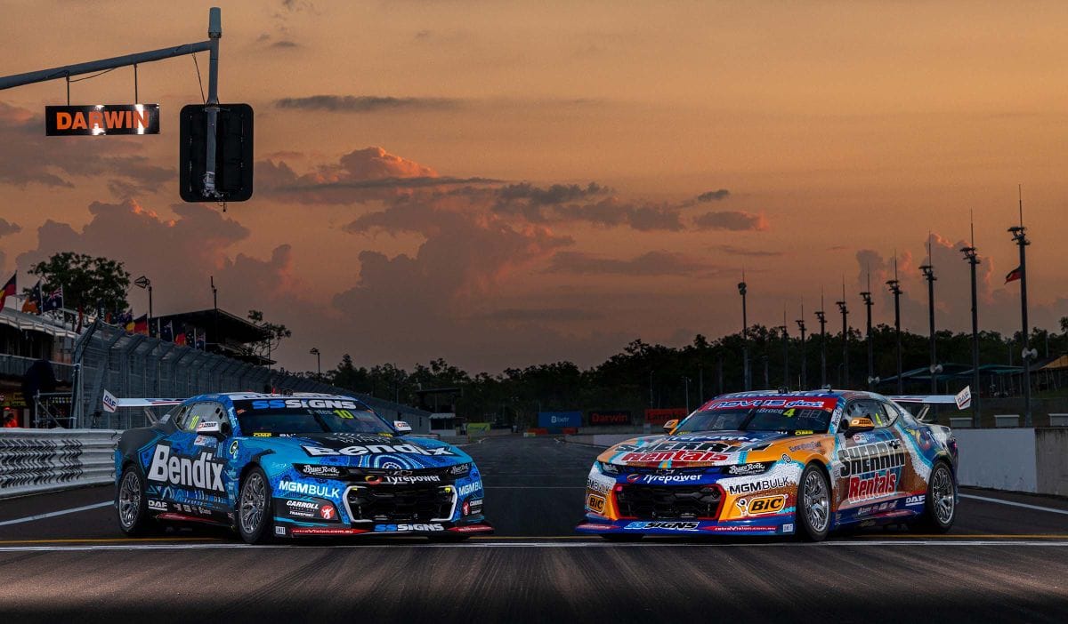 Two Matt Stone Racing Supercars parked on the Hidden Valley Raceway start line at sunset.